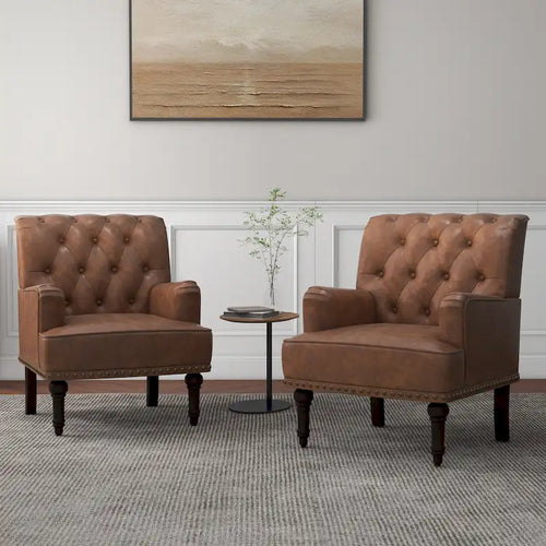 Poltroncina d'appoggio trapuntata in pelle sintetica beige/marrone/nera con dettagli borchiati e gambe intagliate, per 1 persona